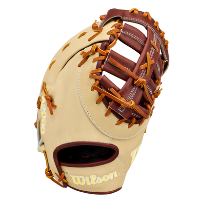 The Wilson A2000 1673 13″ Baseball First Base Mitt (WBG06401RT13) is showcased upright, featuring a tan and brown design with yellow laces, a woven web, and the Wilson logo on the wrist area. Crafted from durable Pro Stock leather, this 13-inch first base mitt is engineered for top-tier performance and reliability.