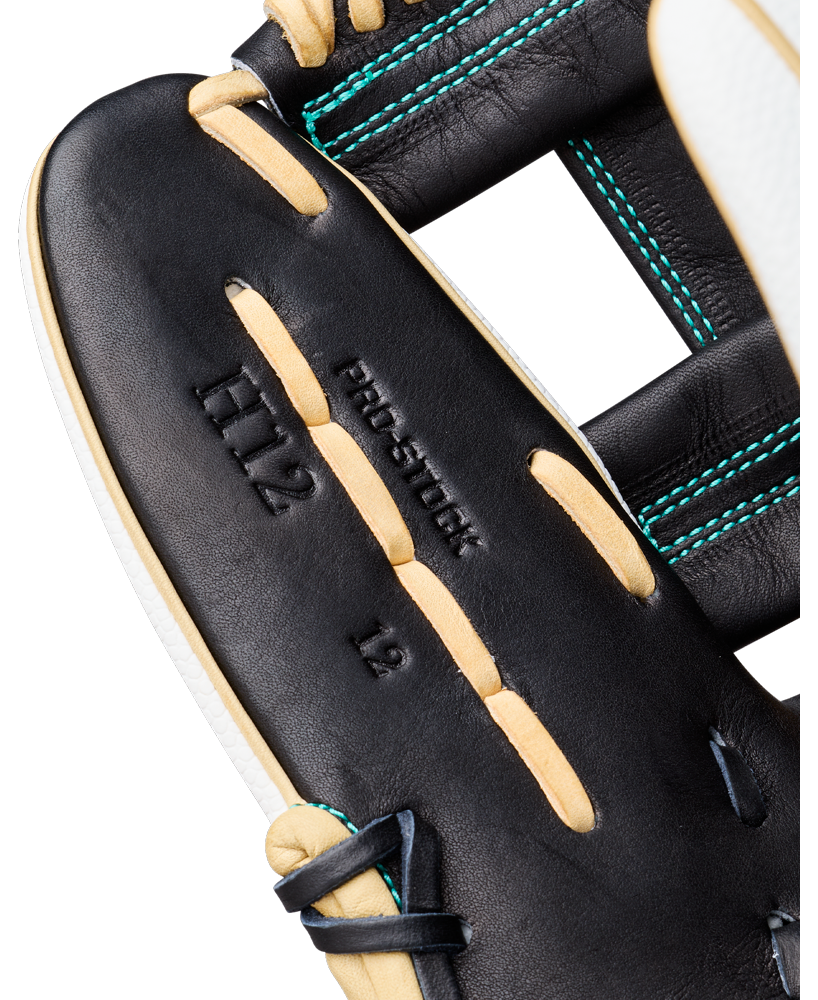 Close-up of a Wilson A2000 H12SS 12″ Fastpitch Glove (model WBG06701RT12) in black leather with tan laces, teal stitching, and embossed text “PRO STOCK H12 12” visible on the glove’s interior. Modeled after the renowned A2000 H12SS, this Wilson infield softball glove combines standout style with superior performance.