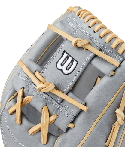 Close-up of a gray Wilson A2000 H12 12″ Fastpitch Glove: WBG06801RT12 with tan laces and white stitching, featuring a black and white embroidered Wilson “W” logo on the wrist strap. This 12” infield glove delivers premium performance and durability for serious players.