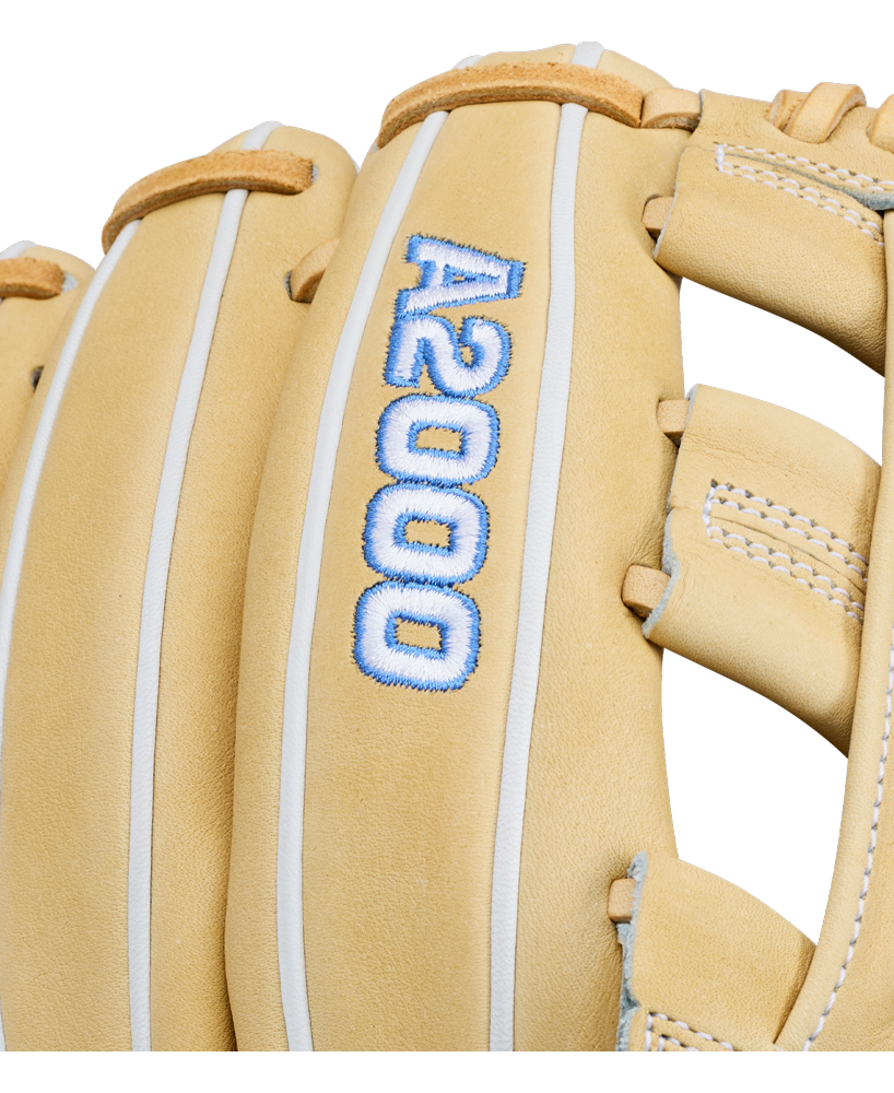 A close-up of the Wilson A2000 FP1712 12″ Fastpitch Glove (WBG06901RT12) in tan leather, featuring “A2000” stitched in blue and white on the back, highlights Wilson’s innovative Flex System for enhanced comfort and performance.