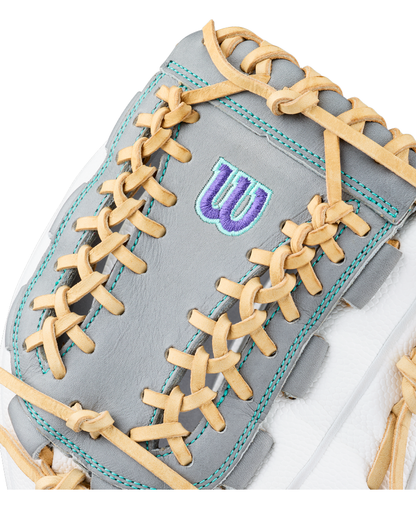 Close-up of a gray and white Wilson A2000 FPHGSS 12″ Fastpitch Glove (WBG07101RT12) featuring tan laces and a blue Wilson “W” logo stitched on the surface. Turquoise stitching outlines select seams, accentuating the advanced Flex System for enhanced comfort. Crafted as a top-tier softball infield glove, this Wilson model showcases premium craftsmanship and standout style.