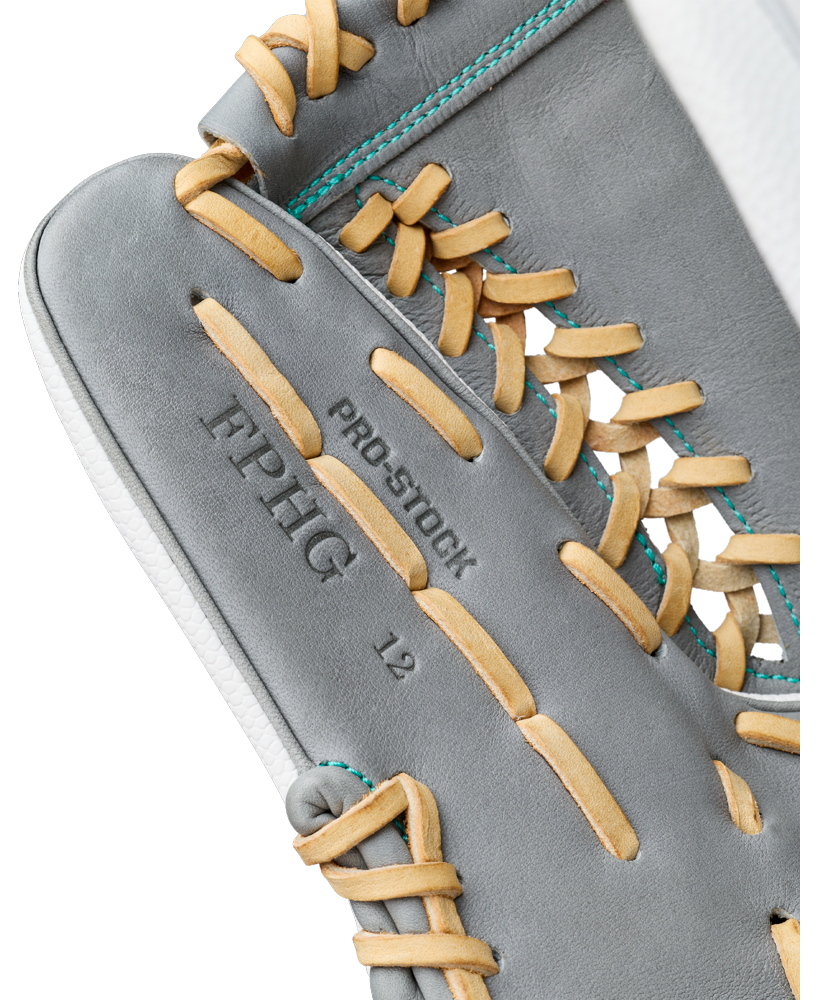 A close-up of a Wilson A2000 FPHGSS 12″ Fastpitch Glove (WBG07101RT12) in gray showcases tan laces, embossed with PRO STOCK, FPHIG, and 12. Teal thread accents feature in the visible stitching detail, emphasizing the exceptional craftsmanship expected from a top-tier Wilson softball infield glove.