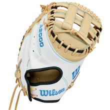 A tan and white Wilson A2000 FPCM23SS 34″ Fastpitch Catcher’s Mitt (WBG07301RT34) features blue stitching, leather laces, and the Wilson logo embroidered on the wrist; this lightweight mitt also includes a durable Dual Post Web for added versatility on the field.