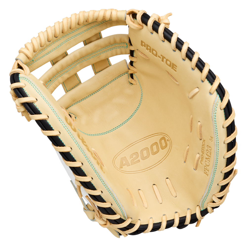 A Wilson A2000 FPCM23SS 34″ Fastpitch Catcher’s Mitt (WBG07301RT34) in tan and black, featuring “A2000” and “PRO-TOE” printed inside, a Dual Post Web design, lacing around the edges, and a webbed pocket.