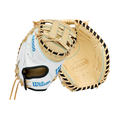 Two Wilson A2000 FPCM23SS 34″ Fastpitch Catcher’s Mitts (WBG07301RT34) in tan and white, one displayed palm side up featuring the A2000 and Pro-Stock markings, the other showing the back with “Wilson” embroidered in blue. Designed with a Dual Post Web, these lightweight gloves deliver both standout style and superior performance for fastpitch catchers.