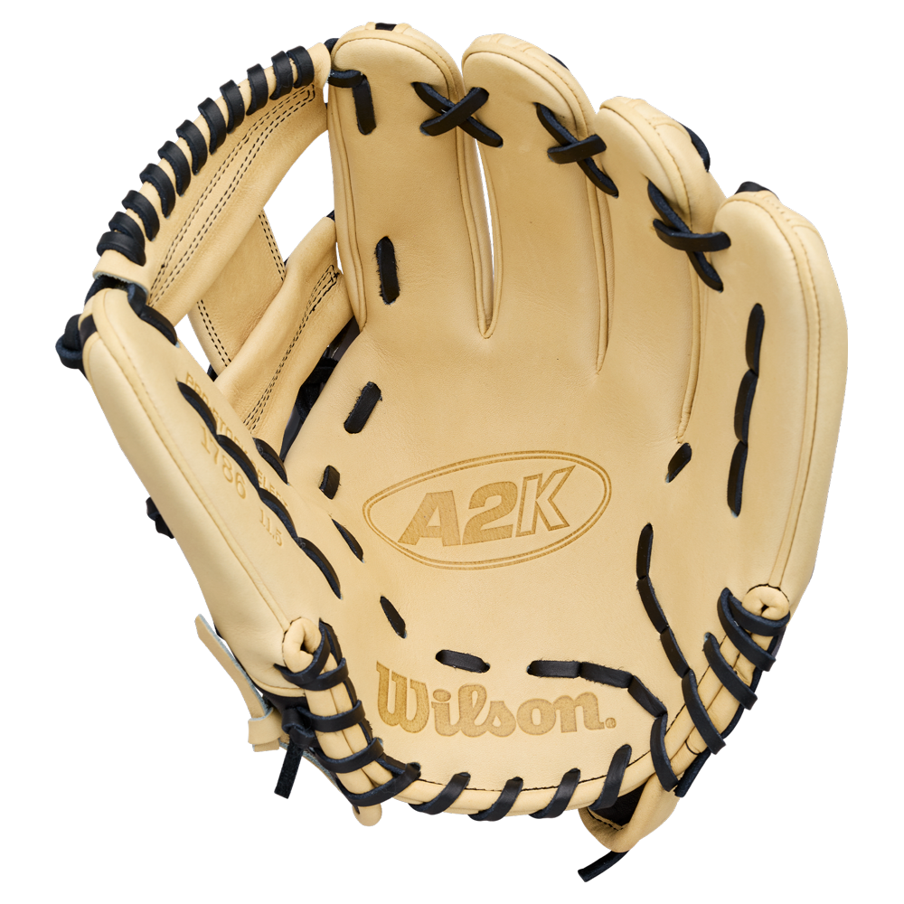 A Wilson A2K 1786 11.5″ Baseball Glove (WBG07601RT115) in tan with black laces is displayed open, showcasing the Wilson brand name and logo on the palm. This premium glove delivers outstanding craftsmanship and performance for dedicated baseball players.