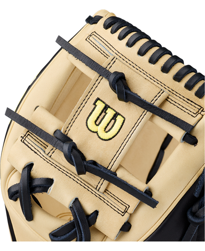 Close-up of a beige Wilson A2K 1786 11.5″ Baseball Glove (WBG07601RT115) featuring black lacing and a yellow Wilson logo stitched on the leather.
