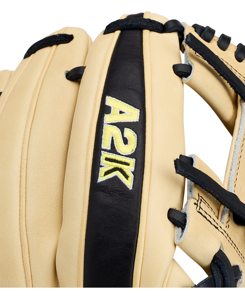 Close-up of the Wilson A2K 1786 11.5″ Baseball Glove (WBG07601RT115) in tan and black, featuring “A2K” stitched in yellow and white on a black leather strip, highlighting the premium craftsmanship of this elite Wilson infield glove.
