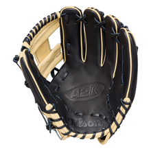 The Wilson A2K 1724 11.75″ Baseball Glove (WBG07701RT1175) by Wilson is pictured open on a plain white background, showcasing its black and tan colorway, visible stitching, Double Palm Construction, and detailed lacing—making it an ideal infielder’s glove for serious players.