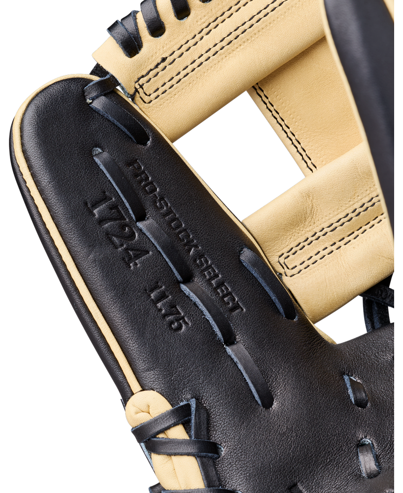 Close-up of a black and tan Wilson A2K 1724 11.75″ Baseball Glove (WBG07701RT1175), showcasing detailed stitching and embossed text. Engineered with Double Palm Construction for enhanced durability and shape retention, this glove is designed with precision by Wilson for serious infielders.