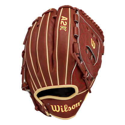 A Wilson A2K C12 12″ Baseball Glove (WBG07901RT12) by Wilson is displayed on a white background, featuring brown and tan leather with yellow and red stitching and a deep pocket ideal for pitchers.