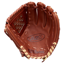 The Wilson A2K C12 12″ Baseball Glove (WBG07901RT12) features an open brown design with tan laces, a deep pocket, and a prominent web pattern on the side. The Wilson brand name is embossed on both the palm and bottom of the glove, making it an excellent choice for pitchers.