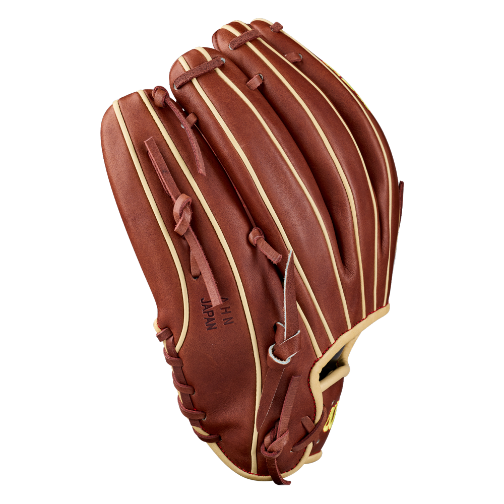 A Wilson A2K C12 12″ baseball glove by Wilson, crafted from brown leather with beige laces, is displayed vertically with the palm side facing away. Featuring a deep pocket ideal for pitchers, the glove has HI JAPAN stamped on the thumb area.