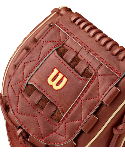 Close-up of a brown Wilson A2K C12 12″ Baseball Glove (WBG07901RT12) featuring red stitching, a yellow-outlined red Wilson “W” logo in the center, detailed lacing, a textured leather surface, and a deep pocket designed for optimal ball control.