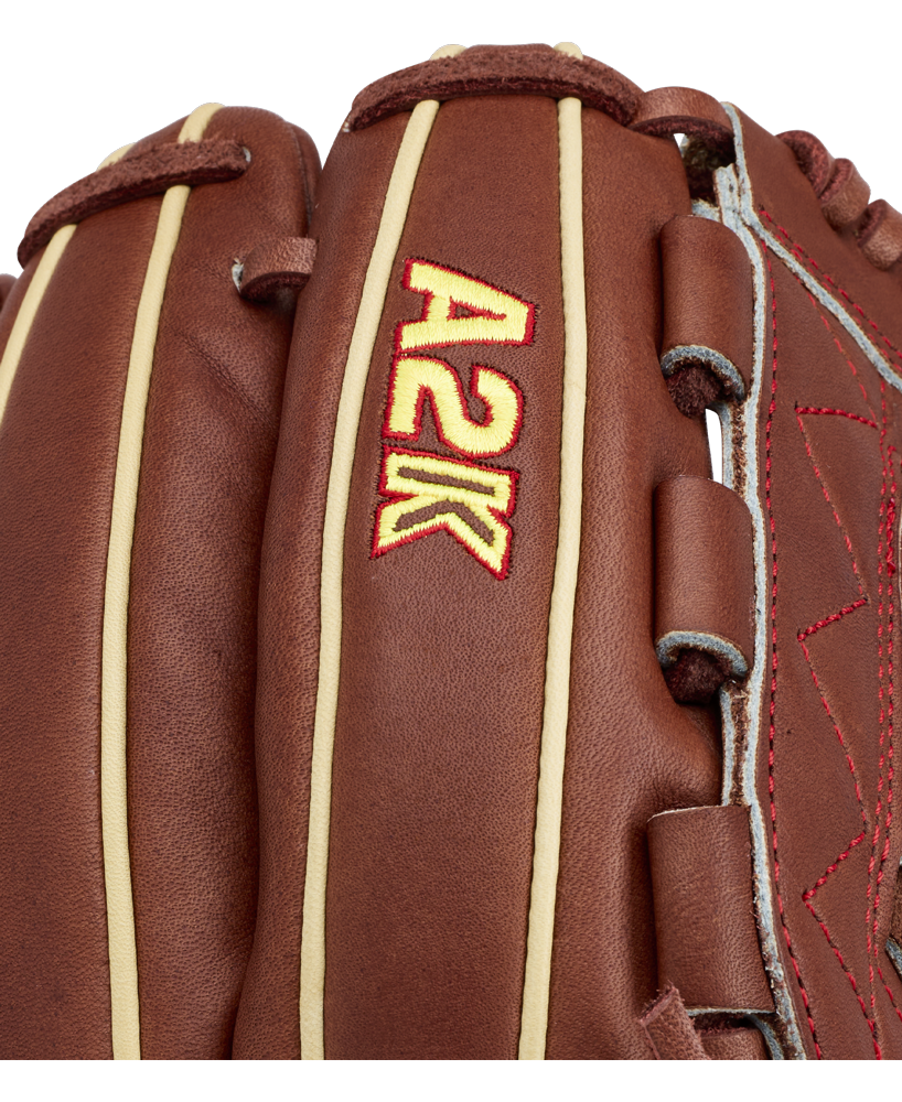 Close-up of the Wilson A2K C12 12″ Baseball Glove (WBG07901RT12) by Wilson, featuring brown leather with tan stitching, the A2K logo embroidered in red and yellow, and a deep pocket designed for optimal performance.