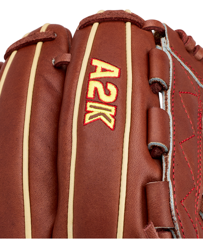 Close-up of the Wilson A2K C12 12″ Baseball Glove (WBG07901RT12) by Wilson, featuring brown leather with tan stitching, the A2K logo embroidered in red and yellow, and a deep pocket designed for optimal performance.