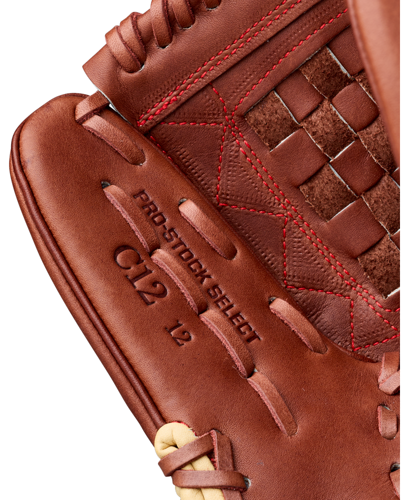 Close-up of the Wilson A2K C12 12″ Baseball Glove (WBG07901RT12) by Wilson, featuring premium brown leather with “PRO STOCK SELECT” and “CL2 L2” embossed on the interior. The image showcases intricate red stitching, a woven web, and a deep pocket—making it perfect for use as a pitcher’s glove.