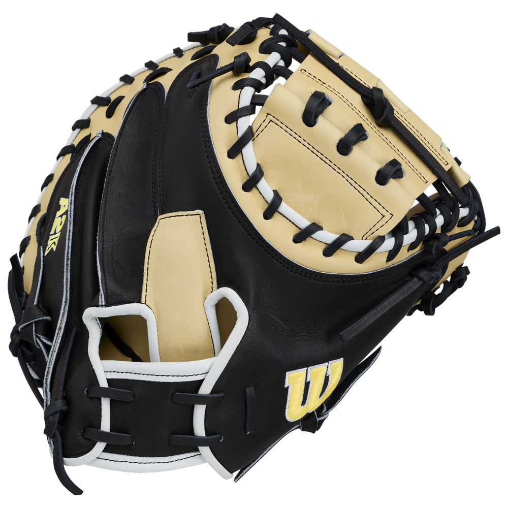 A tan and black Wilson A2K 1734 34″ Baseball Catcher’s Mitt (WBG10701RT34) featuring black lacing, white accents, Double Palm Construction for added support, and a yellow Wilson “W” logo on the side.