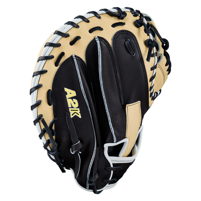 Introducing the Wilson A2K 1734 34″ Baseball Catcher’s Mitt (WBG10701RT34) by Wilson, a black and tan catcher’s mitt featuring “A2K” on the back and highlighted by white stitching and lacing along the edges. Expertly crafted with Double Palm Construction, this premium glove delivers outstanding stability and durability behind the plate.
