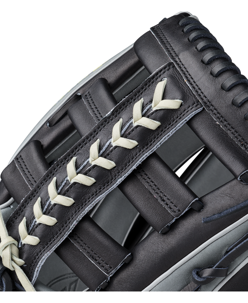 Close-up of a black Wilson A2K 1810 12.75″ Baseball Glove (WBG10802RT1275) crafted from Pro Stock Select leather with cream-colored laces, featuring intricate stitching and padding—an outstanding Wilson glove option for outfielders.