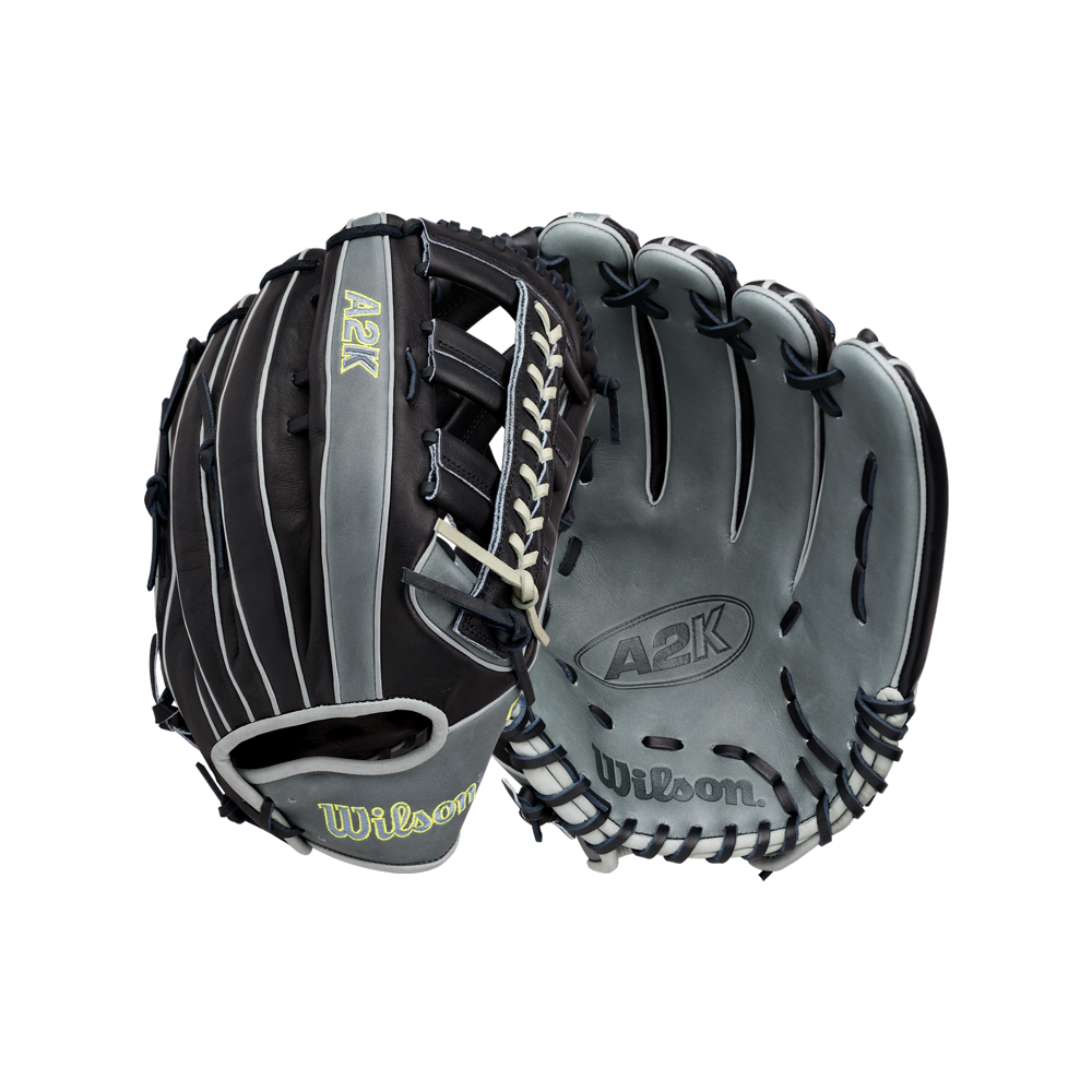 A Wilson A2K 1810 12.75″ Baseball Glove (WBG10802RT1275) by Wilson is showcased, expertly crafted from premium Pro Stock Select leather. The glove highlights a grey leather palm embossed with the A2K and Wilson logos, while the back sports a striking black and grey design with yellow A2K and Wilson logos, complemented by white laces. Designed for serious outfielders, this glove features the renowned A2K 1810 pattern for exceptional performance.