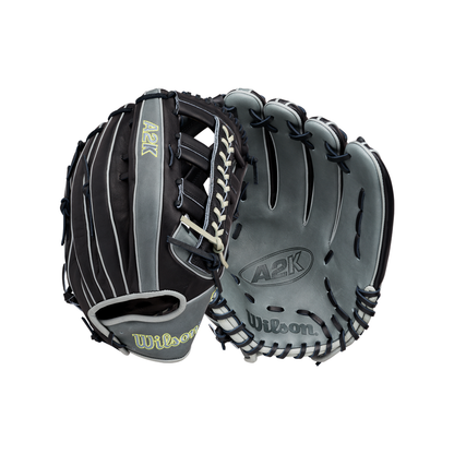 A Wilson A2K 1810 12.75″ Baseball Glove (WBG10802RT1275) by Wilson is showcased, expertly crafted from premium Pro Stock Select leather. The glove highlights a grey leather palm embossed with the A2K and Wilson logos, while the back sports a striking black and grey design with yellow A2K and Wilson logos, complemented by white laces. Designed for serious outfielders, this glove features the renowned A2K 1810 pattern for exceptional performance.