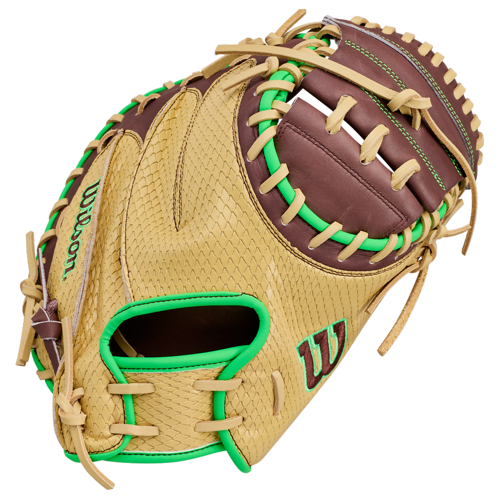 A Wilson A1000 CM33 DUBAI 33″ Baseball Catcher’s Mitt (WBG25101RT33) in tan and brown, featuring green stitching and accents, with an open pocket and detailed lacing.