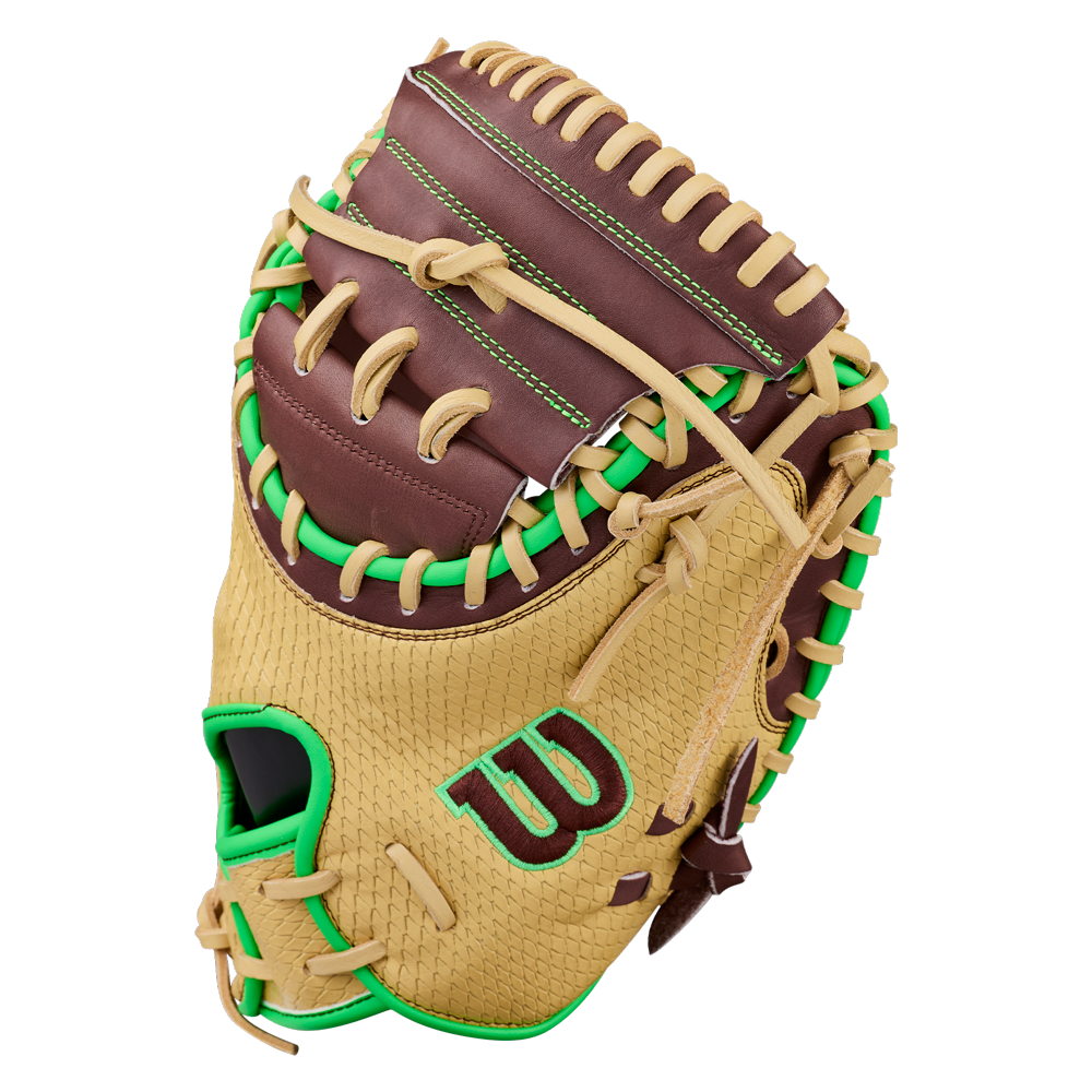 A tan and brown Wilson A1000 CM33 DUBAI 33″ baseball catcher’s mitt with green laces and accents, featuring a green W logo on the side.