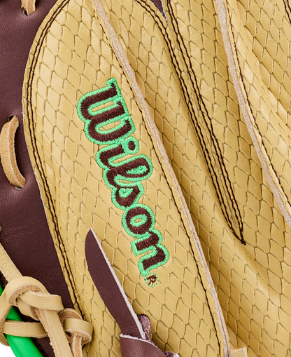 Close-up of a tan and brown Wilson A1000 CM33 DUBAI 33″ Baseball Catcher’s Mitt, highlighting the textured leather and green-embroidered Wilson logo.