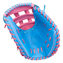 A Wilson A1000 FPCM33 MOMENTUM 33″ Fastpitch Catcher’s Mitt (WBG25301RT33), featuring a blue exterior with pink laces and interior, is crafted from durable Full Grain leather and displayed open to reveal its palm and webbing against a white background.