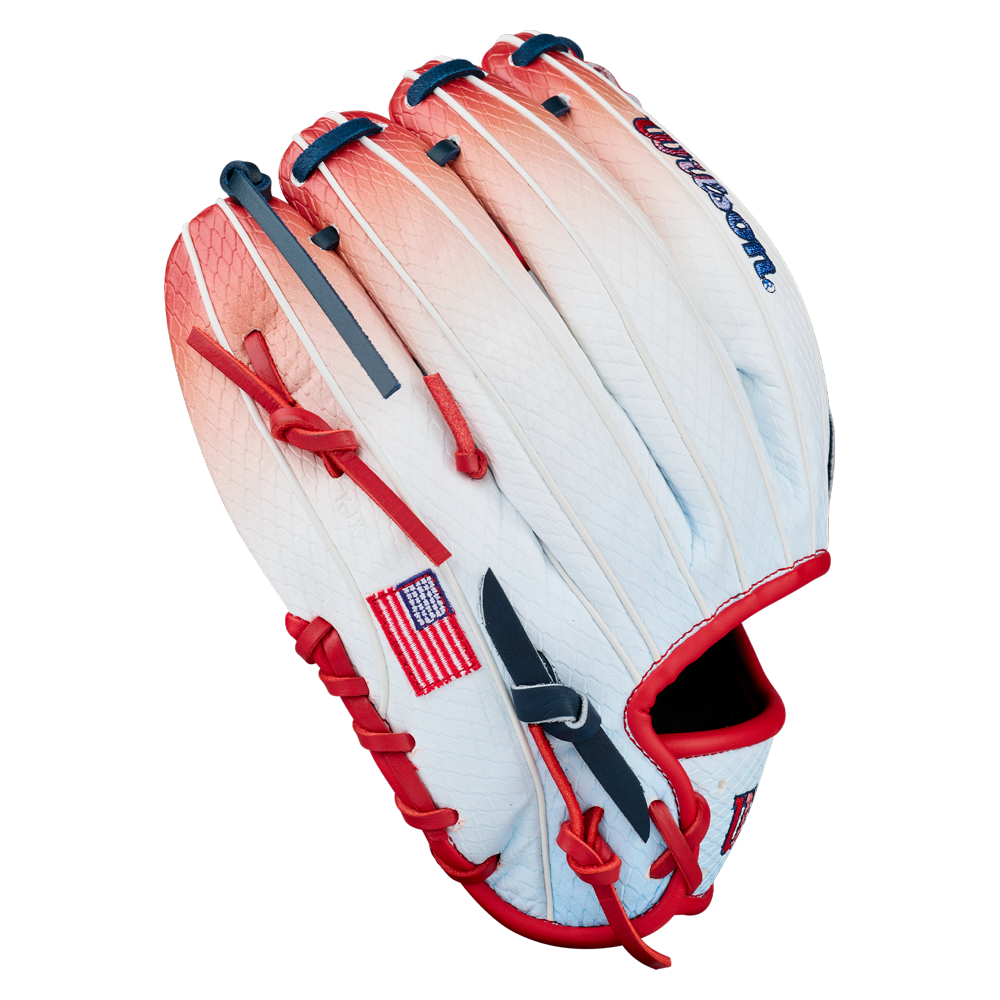 Introducing the Wilson A1000 1787 FREEBIRD 2.0 11.75″ Baseball Glove (WBG26501RT1175): crafted from white Full Grain leather with striking red and blue accents, this stylish infield glove features an American flag patch on the side—perfect for baseball players who value both performance and standout design.