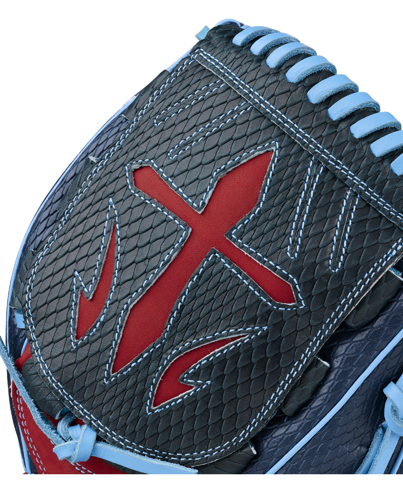A close-up of the Wilson A1000 B23 GENO 12″ Baseball Glove (WBG26601RT12) by Wilson highlights its black, scale-like texture, red accents, blue laces and stitching, and distinctive red cross-shaped design on the pocket. This premium pitcher’s glove combines eye-catching style with top-notch performance for serious players on the field.