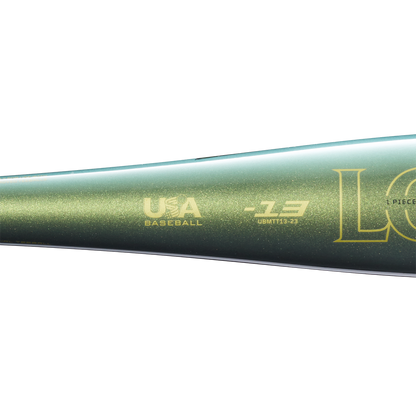 Close-up of the metallic green 2023 Louisville Slugger Meta (-13) 2 5/8" USA T-Ball Baseball Bat (WBL2667010) with gold USA Baseball and Louisville Slugger logos on its barrel, shown against a plain white background.