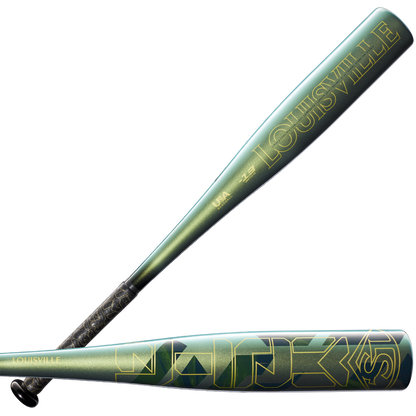 Two metallic green 2023 Louisville Slugger Meta (-13) USA T-Ball bats are shown, one upright and one horizontal, both with bold gold lettering, geometric patterns, and an advanced composite barrel design.