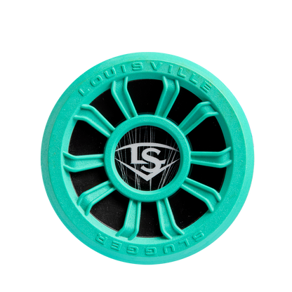 A turquoise and black circular item with a wheel design, LS logo at the center, and "Louisville Slugger Atlas" on the edge, inspired by the 2025 Louisville Slugger Atlas (-5) USSSA Baseball Bat: WBL2981010.