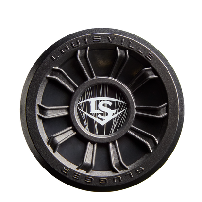 A black circular metal piece with “Louisville Slugger” and “LS” logos, sporting a wheel-like design, echoes the 2026 Louisville Slugger Select PWR (-8) USA Baseball Bat (WBL4127010) by Louisville Slugger on a white background.