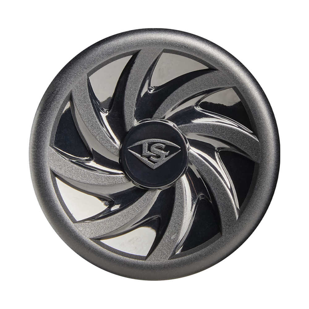 A metallic, circular object with a black center engraved with the Louisville Slugger logo. Its outer edge mirrors the swirling, reflective blade design of the 2026 Louisville Slugger Atlas (-12.5) T-Ball Bat against a white background.