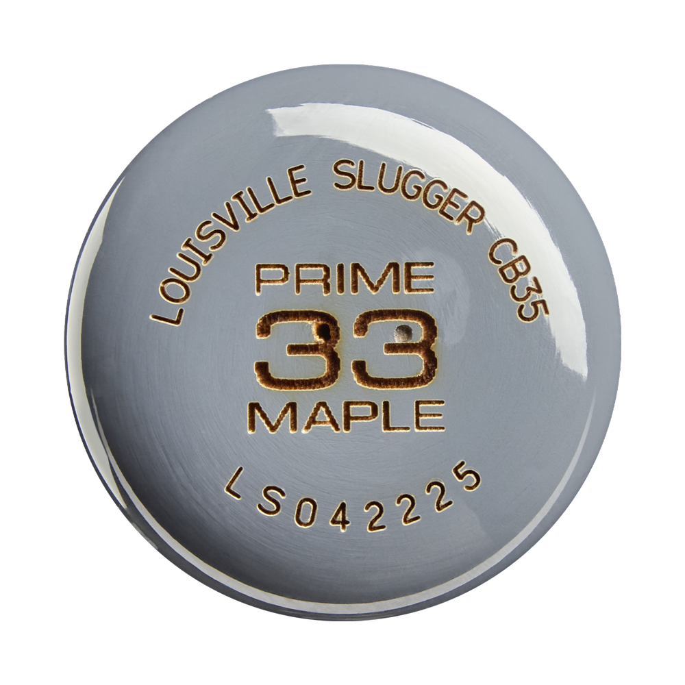 A close-up of a metallic bat end cap with engraved text: LOUISVILLE SLUGGER CB35, PRO PRIME MAPLE, WBL4154010 on a shiny silver surface, highlighting the premium craftsmanship of the Louisville Slugger Pro Prime CB35 Maple Wood Baseball Bat.