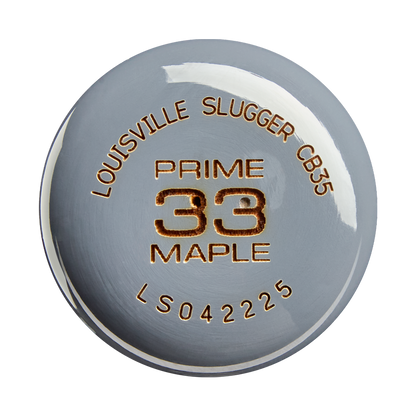 A close-up of a metallic bat end cap with engraved text: LOUISVILLE SLUGGER CB35, PRO PRIME MAPLE, WBL4154010 on a shiny silver surface, highlighting the premium craftsmanship of the Louisville Slugger Pro Prime CB35 Maple Wood Baseball Bat.