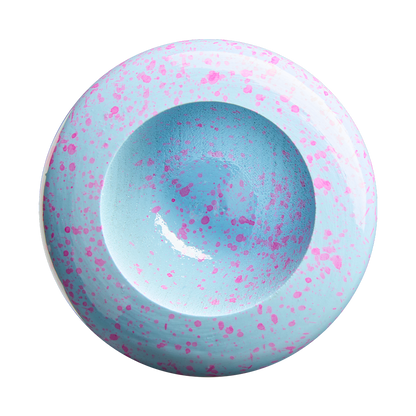 A round, shallow ceramic bowl viewed from above, painted light blue with pink splatter patterns both inside and outside the bowl. The design evokes the clean, classic aesthetic of the Louisville Slugger Pro Prime EDLC44 Maple Wood Baseball Bat (WBL4155010) by Louisville Slugger, standing out against a plain white background.