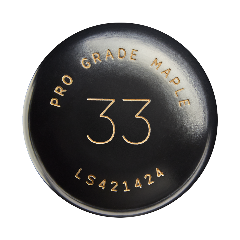 A black circular bat knob from Louisville Slugger, featuring gold text that reads PRO GRADE MAPLE, the number 33 in the center, and LS421424 at the bottom. This knob belongs to the Louisville Slugger Players Cut Maple Wood Baseball Bat (WBL4158010), crafted with Players Cut Maple and finished with an EXOPRO-Ppr Hardcoat for enhanced durability.