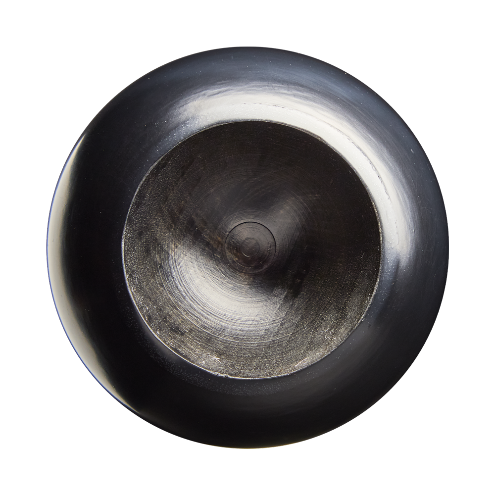 A close-up, top-down view of a black, shiny, circular detail with a slightly recessed center and reflective surface on a plain white background, showcasing the refined finish characteristic of the Louisville Slugger Players Cut Maple Wood Baseball Bat: WBL4158010 by Louisville Slugger.