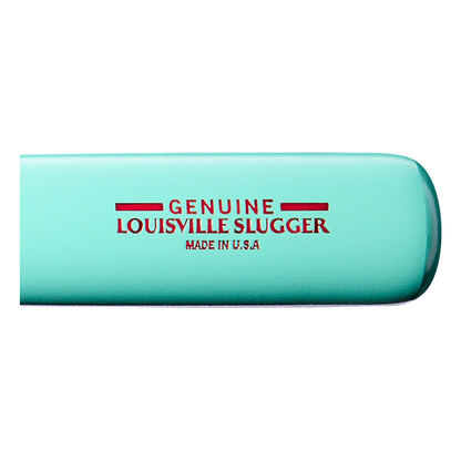 A close-up of the Louisville Slugger Genuine MIX Mint Wood Baseball Bat (WBL4191010) in turquoise, featuring bold red text reading GENUINE LOUISVILLE SLUGGER MADE IN U.S.A on its side, highlights its balanced swing weight—a hallmark of Louisville Slugger’s premium wood bats.