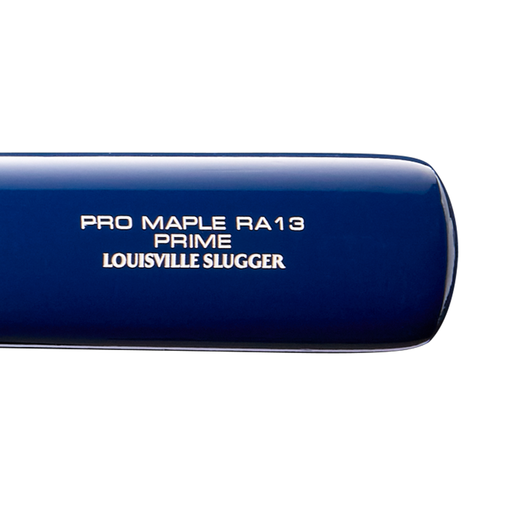 Close-up of a blue Louisville Slugger Pro Prime RA13 USA Maple Wood Baseball Bat (WBL4296010), with white text on the barrel, featuring Seamless Decals and a Professional Series Finish for a premium look and feel.
