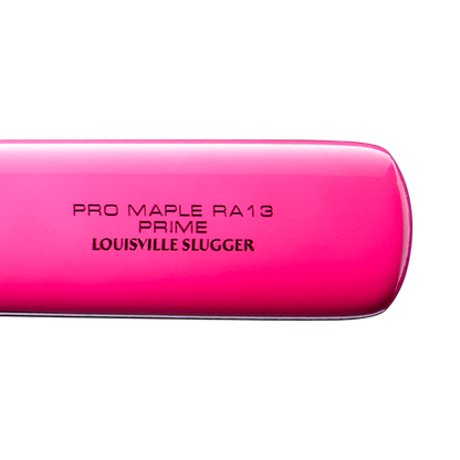 Close-up of a vibrant pink Louisville Slugger Pro Prime RA13 Sunset Maple Wood Baseball Bat (WBL4297010) engraved with PRO MAPLE RA13 PRIME and LOUISVILLE SLUGGER in black text on a white background, highlighting the Professional Series Finish for the ultimate pro-level experience.