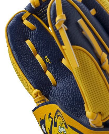 A close-up of the Wilson A200 EZ Catch Savannah Bananas 10" Youth Baseball Glove (WBW10135910) shows navy blue and yellow leather, detailed stitching, textured surface, an EZ Catch design, and "10”" printed inside.
