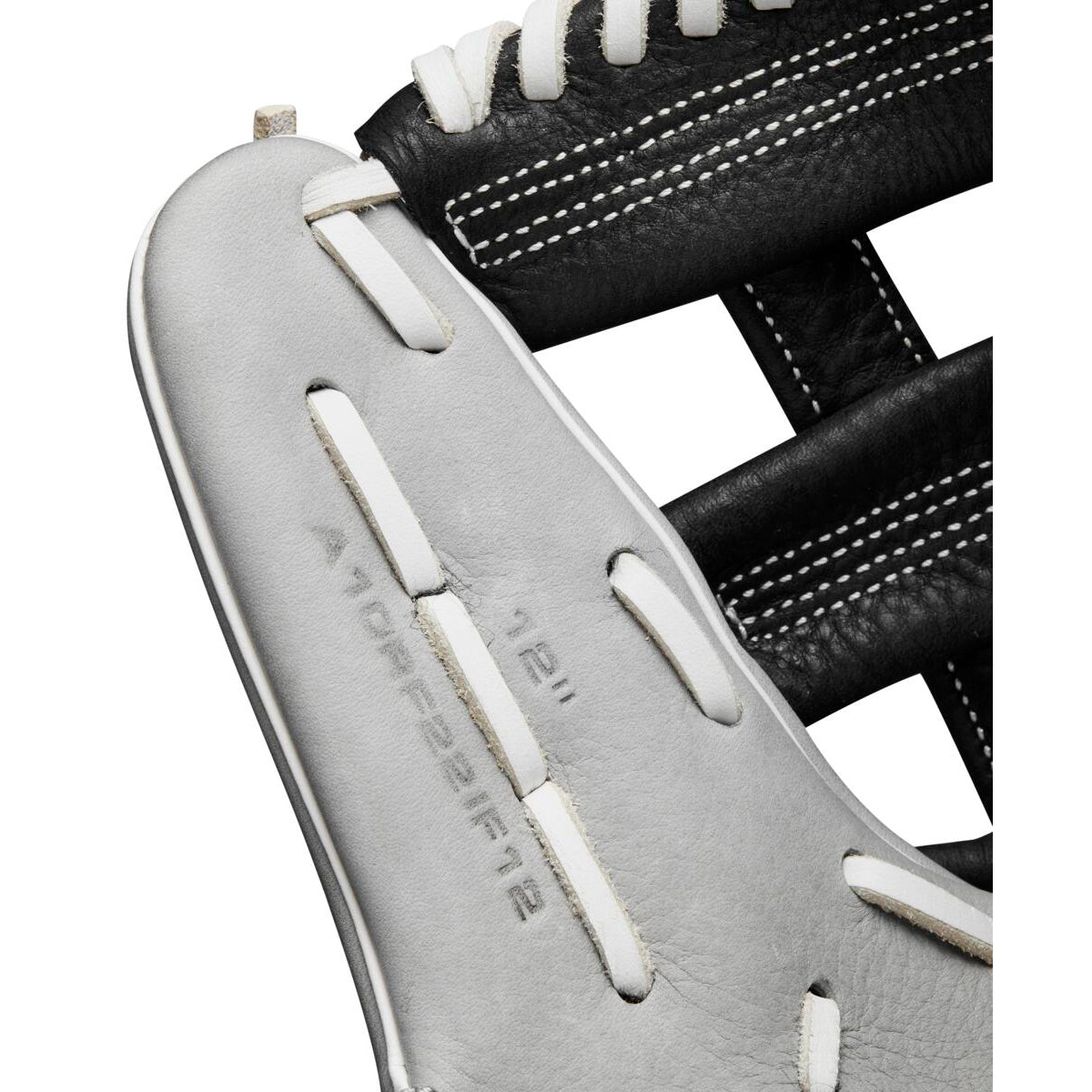 Close-up of the Wilson A1000 IF12 12" Fastpitch Glove (WBW10145612) in black and white, highlighting detailed stitching, lacing, and embossed model and size info on the white leather.