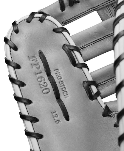 Close-up of the Wilson A2000 1620SS 12.5" SuperSkin Fastpitch First Base Mitt (WBW101644125) by Wilson, highlighting black lacing, stitching, embossed text, and smooth Pro Stock leather inside the glove.