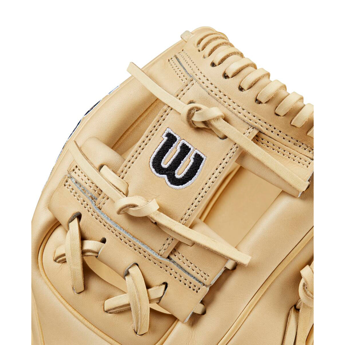 Close-up of the Wilson A2000 1786 11.5" Baseball Glove, crafted from Pro Stock leather with detailed laces and a black-and-white embroidered Wilson “W” logo on the strap.
