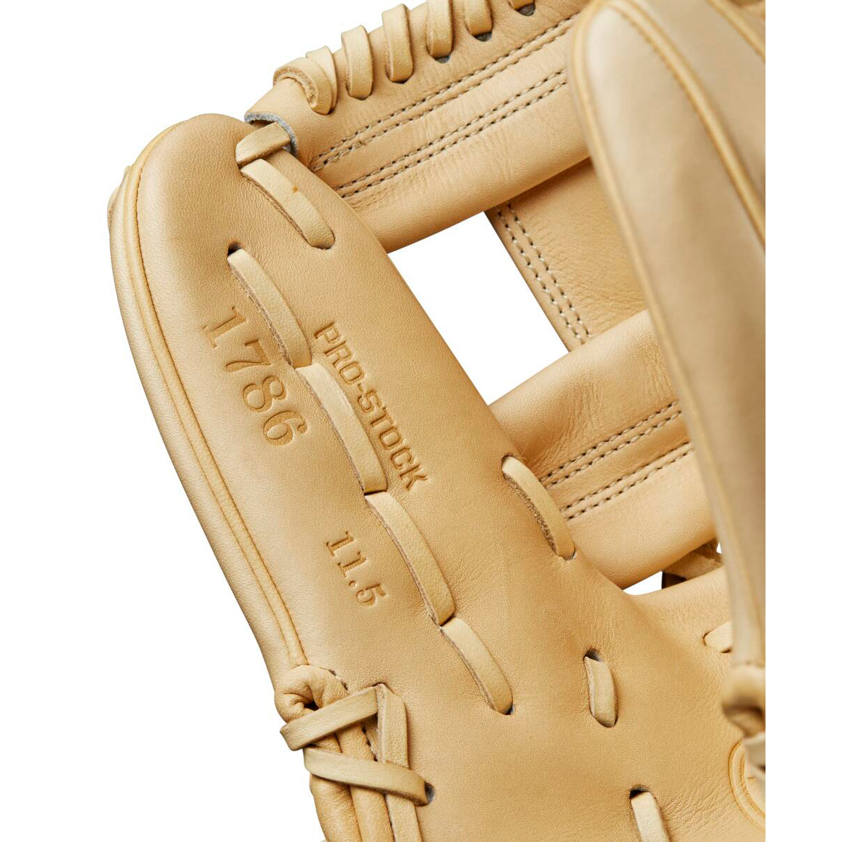 Close-up of a tan Wilson A2000 1786 11.5" Baseball Glove (WBW102072115) crafted from Pro Stock leather, featuring embossed text: 1786, PRO STOCK, and 11.5 on the palm.